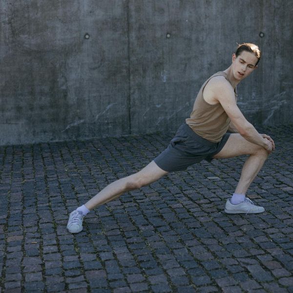 Person feeling energized and stretching after a gentle cardio workout.